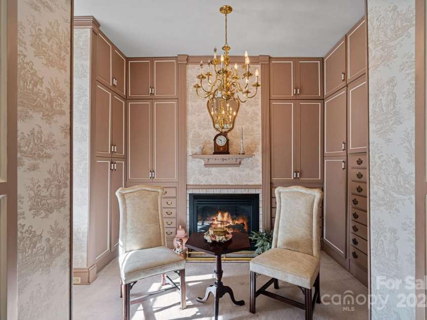 104 Leslie Loop, Mooresville, NC 28115.  MLS# CAR4195674, YatesRealty ID 301. Dressing Room has built-in armoires and a cozy gas logs fireplace that functions!