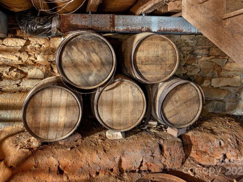 104 Leslie Loop, Mooresville, NC 28115.  MLS# CAR4195674, YatesRealty ID 301. Great storage under the home with earth floors and granite piers