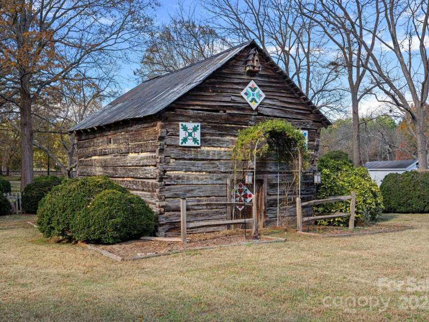 104 Leslie Loop, Mooresville, NC 28115.  MLS# CAR4195674, YatesRealty ID 301. Log Barn outbuilding