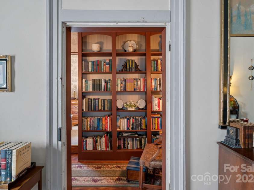 104 Leslie Loop, Mooresville, NC 28115.  MLS# CAR4195674, YatesRealty ID 301. Looking from rear Parlor into hall that leads to the only Bathroom in the home