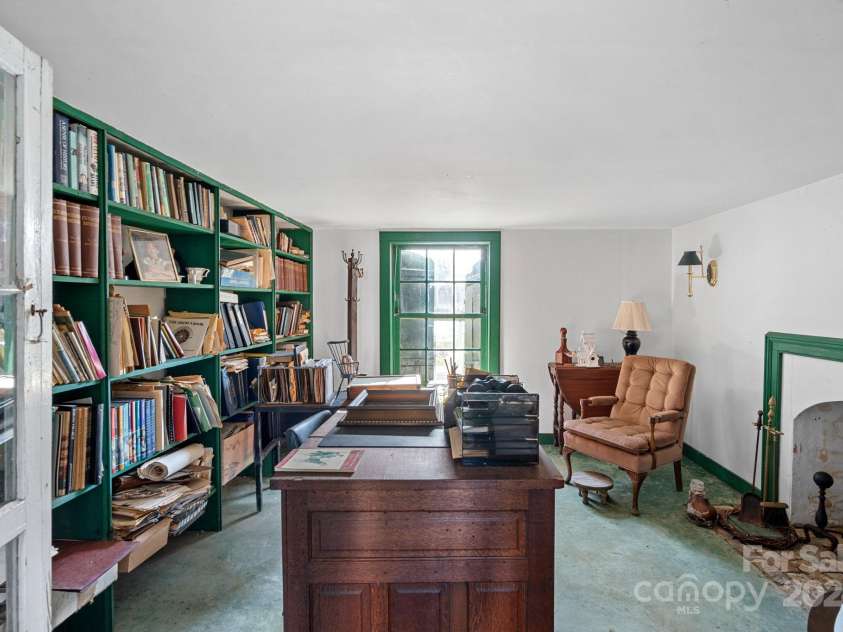 104 Leslie Loop, Mooresville, NC 28115.  MLS# CAR4195674, YatesRealty ID 301. Office under the house with concrete floors and fireplace