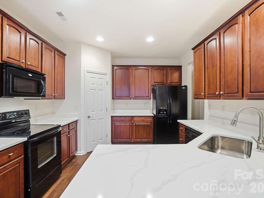 284 Garnet Court, Fort Mill, SC 29708.  MLS# CAR4341140, YatesRealty ID 3010. Spacious Kitchen with New Quartz Counters