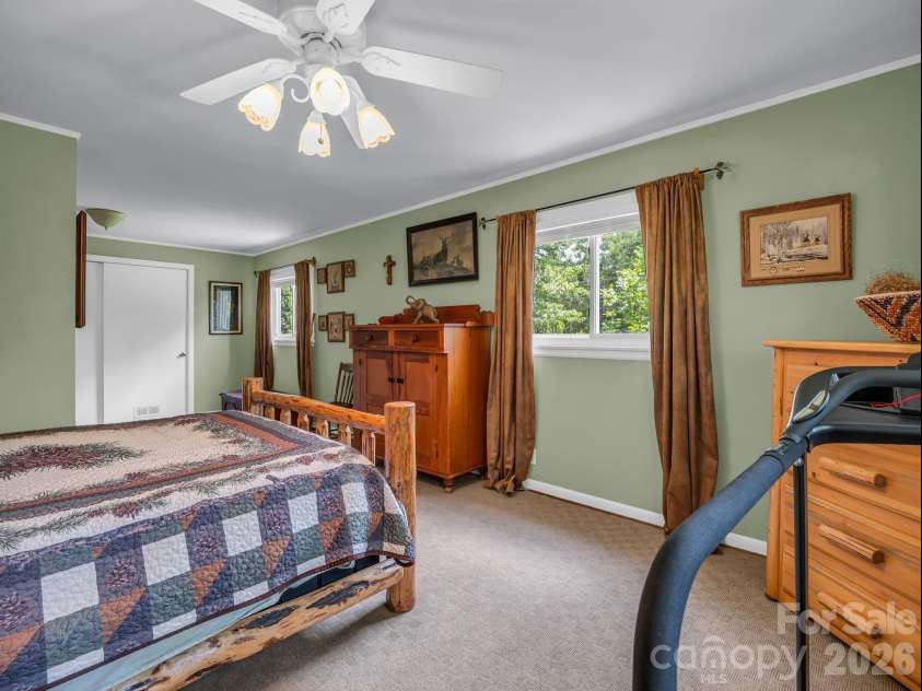 10 Deer Run Lane, Columbus, NC 28722.  MLS# CAR4392486, YatesRealty ID 30101. Primary bedroom with ensuite bathroom