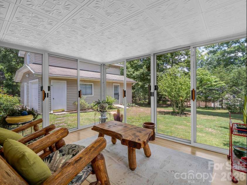 10 Deer Run Lane, Columbus, NC 28722.  MLS# CAR4392486, YatesRealty ID 30101. Sunroom overlooks the back yard