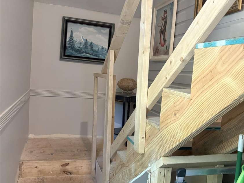 1712 Umstead Street, Charlotte, NC 28205.  MLS# CAR4274346, YatesRealty ID 30104. Stairway to unfinished attic space.