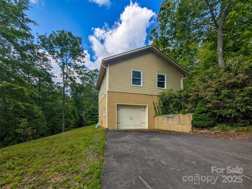 355 Rosewood Lane, Burnsville, NC 28714.  MLS# CAR4263679, YatesRealty ID 30113. Lower Level Garage Parking Or workshop area.