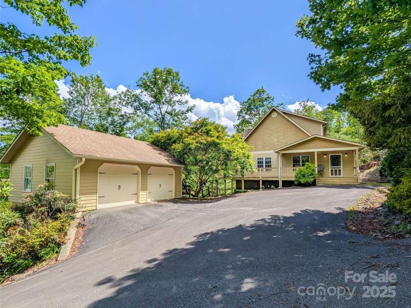 355 Rosewood Lane, Burnsville, NC 28714.  MLS# CAR4263679, YatesRealty ID 30113. Welcome to 355 Rosewood Lane! Main Home w/Detached 2 Story Garage includes main level garage for 2 cars and lower level garage for one car.