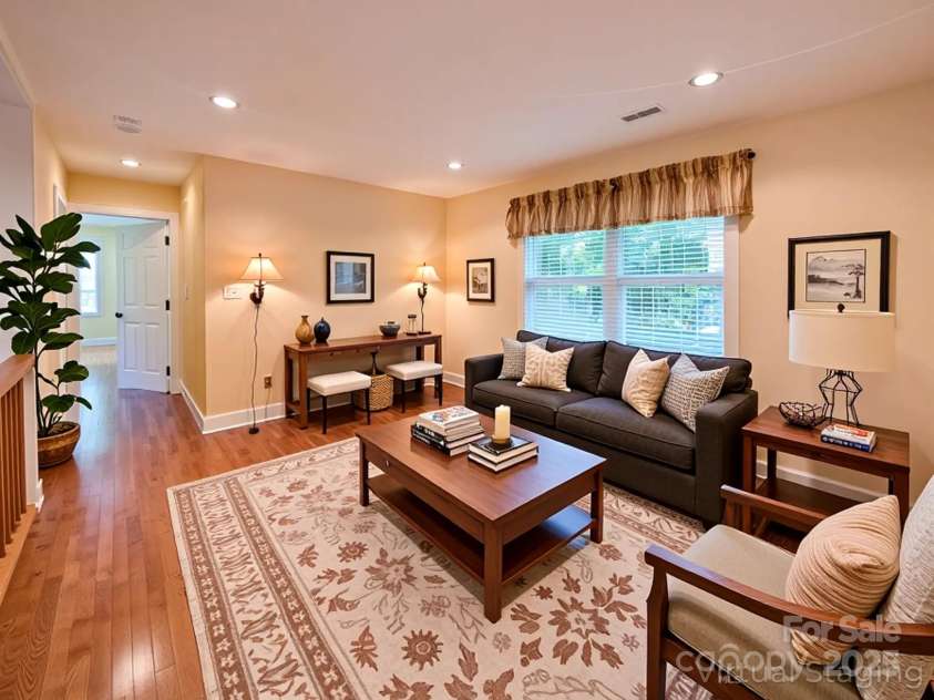 355 Rosewood Lane, Burnsville, NC 28714.  MLS# CAR4326302, YatesRealty ID 30113. Additional Primary Ensuite on Main Level is ideal for those preferring main level living. Offering hardwood flooring, abundant natural lighting, walk-in closet & private full bathroom.