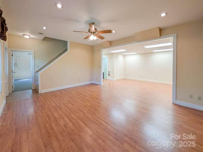 355 Rosewood Lane, Burnsville, NC 28714.  MLS# CAR4326302, YatesRealty ID 30113. Downstairs you will find the fully finished basement that offers additional flex-space with recessed lighting, beautiful hardwood flooring & open concept design ideal for recreation, hobbies, additional living area & mo