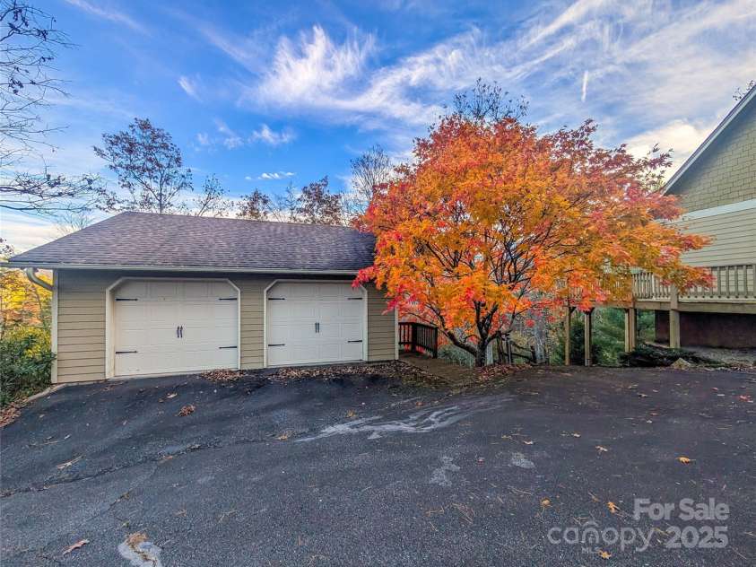 355 Rosewood Lane, Burnsville, NC 28714.  MLS# CAR4326302, YatesRealty ID 30113. Enjoy the spacious two-story garage - view of main level garage access from paved entry/driveway with gorgeous maple tree showing off its beautiful colors late fall! 