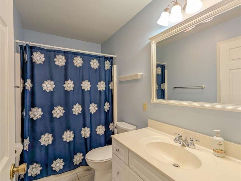 355 Rosewood Lane, Burnsville, NC 28714.  MLS# CAR4326302, YatesRealty ID 30113. Full bathroom in hallway on main level is ideal for guest but also offer hidden pocket door access to additional bedroom! 