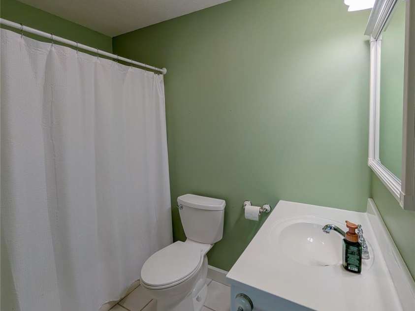 355 Rosewood Lane, Burnsville, NC 28714.  MLS# CAR4326302, YatesRealty ID 30113. Full Bathroom off main level primary ensuite.