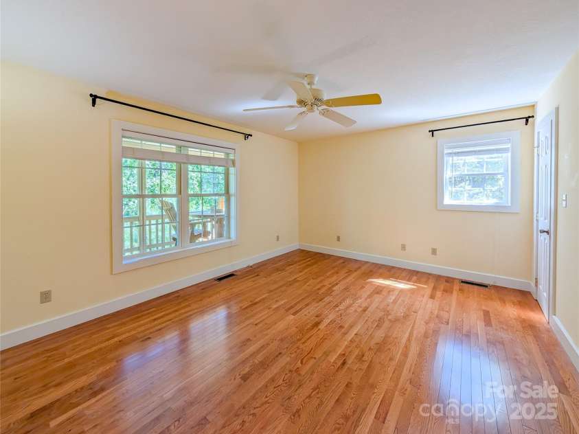 355 Rosewood Lane, Burnsville, NC 28714.  MLS# CAR4326302, YatesRealty ID 30113. Large Walk-In Closet with built-in shelving in upstairs primary ensuite offers plenty of storage space!