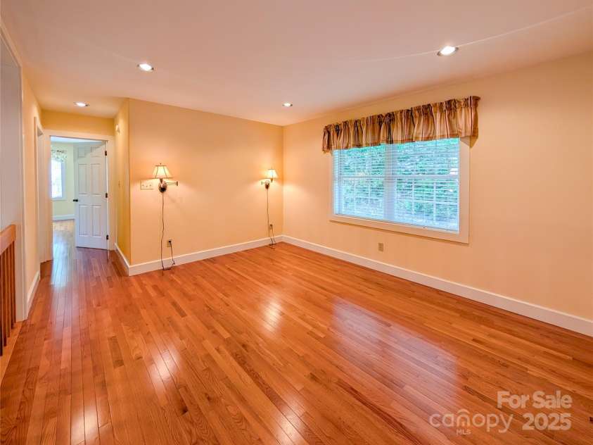 355 Rosewood Lane, Burnsville, NC 28714.  MLS# CAR4326302, YatesRealty ID 30113. The upstairs loft is a flexible for your needs with recessed lighting, beautiful hardwood flooring & natural light -whether that be office space, sitting room or other. 