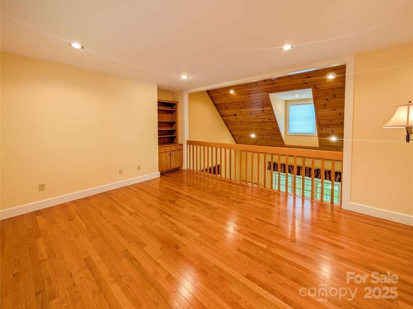 355 Rosewood Lane, Burnsville, NC 28714.  MLS# CAR4326302, YatesRealty ID 30113. The upstairs loft is a flexible for your needs with recessed lighting, beautiful hardwood flooring & natural light -whether that be office space, sitting room or other. 