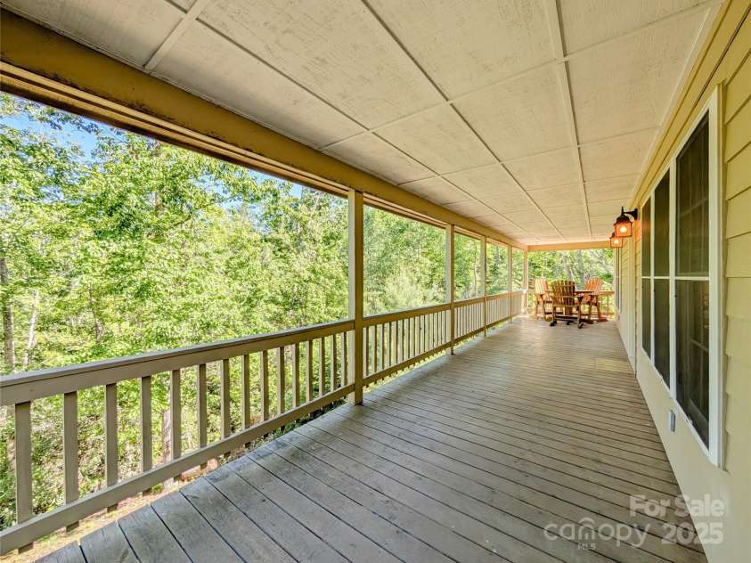355 Rosewood Lane, Burnsville, NC 28714.  MLS# CAR4326302, YatesRealty ID 30113. The wrap around covered porch is such a relaxing place to enjoy nature & wind down after a long day with a glass of wine. Enjoy winter mountain views, bird watching, entertaining guests & more! A propane gas hookup for 