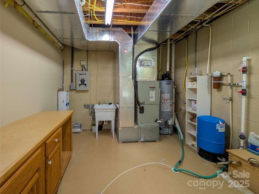 355 Rosewood Lane, Burnsville, NC 28714.  MLS# CAR4326302, YatesRealty ID 30113. Utility Room/Laundry room located in finished basement. 