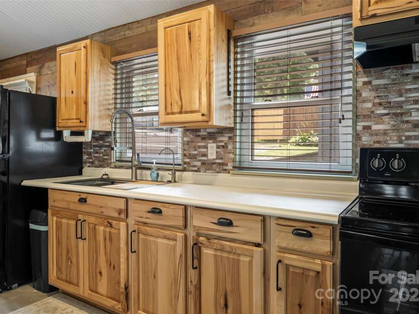 1623 Soco Road, Maggie Valley, NC 28751.  MLS# CAR4281971, YatesRealty ID 30118. Kitchen touts stunning cabinetry, appealing design, and brand new sink!