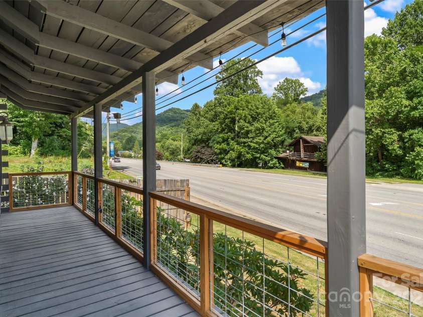 1623 Soco Road, Maggie Valley, NC 28751.  MLS# CAR4281971, YatesRealty ID 30118. Soak in the mountainous splendor from the covered wrap-around porch.