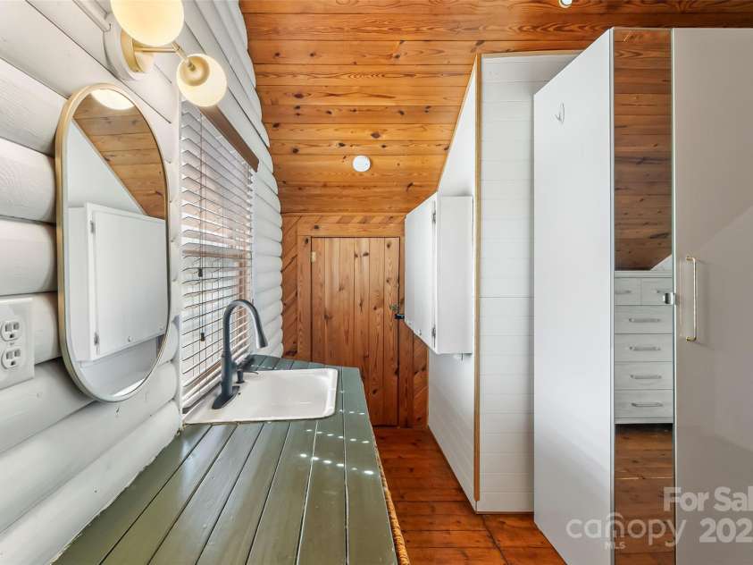 1623 Soco Road, Maggie Valley, NC 28751.  MLS# CAR4281971, YatesRealty ID 30118. Upper loft bedroom closet features storage space