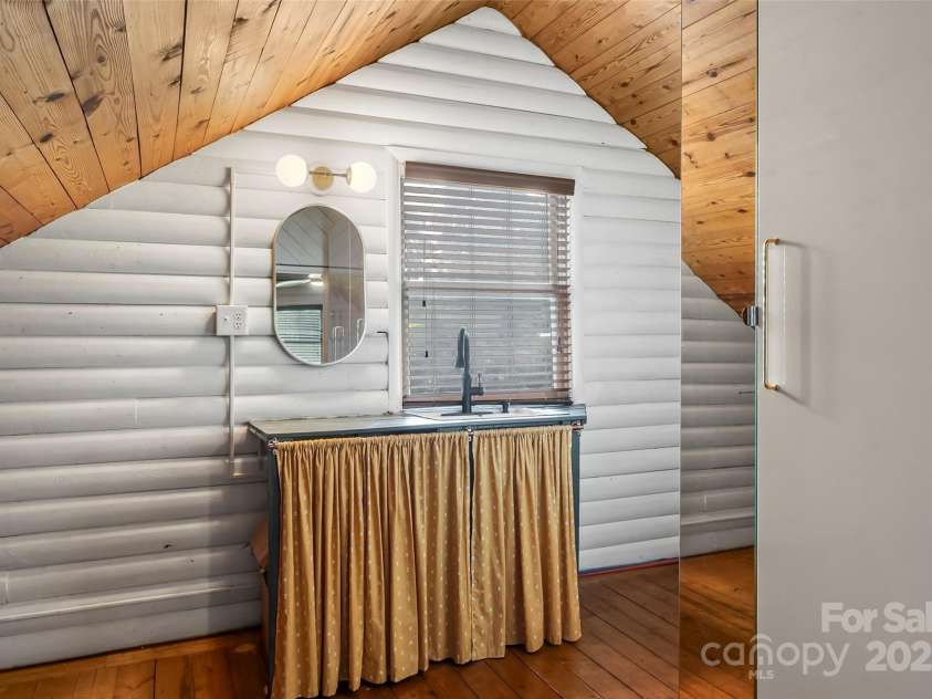 1623 Soco Road, Maggie Valley, NC 28751.  MLS# CAR4281971, YatesRealty ID 30118. Vanity with sink in upper loft bedroom