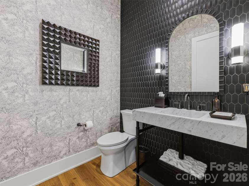 120 Boulder Creek Way, Asheville, NC 28805.  MLS# CAR4356297, YatesRealty ID 30119. First-floor guest bath with custom forest wallpaper and tiled vanity accent