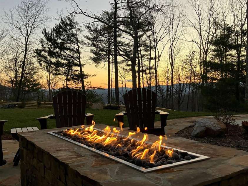 120 Boulder Creek Way, Asheville, NC 28805.  MLS# CAR4356297, YatesRealty ID 30119. Gas fire pit at sunset