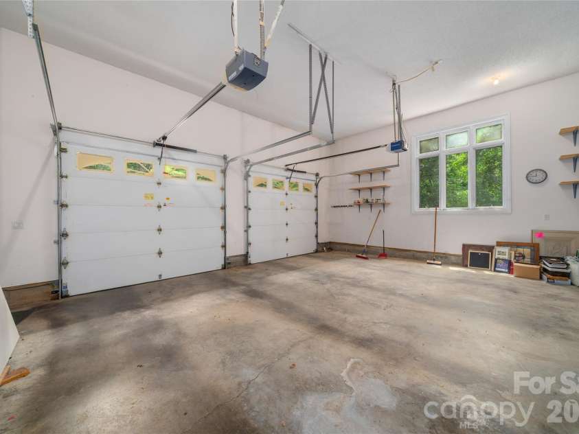 136 Rumbling Bald Road, Lake Lure, NC 28746.  MLS# CAR4393328, YatesRealty ID 30129. 2 car attached garage