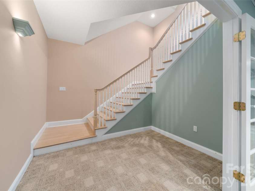 136 Rumbling Bald Road, Lake Lure, NC 28746.  MLS# CAR4393328, YatesRealty ID 30129. Foyer on lowest level