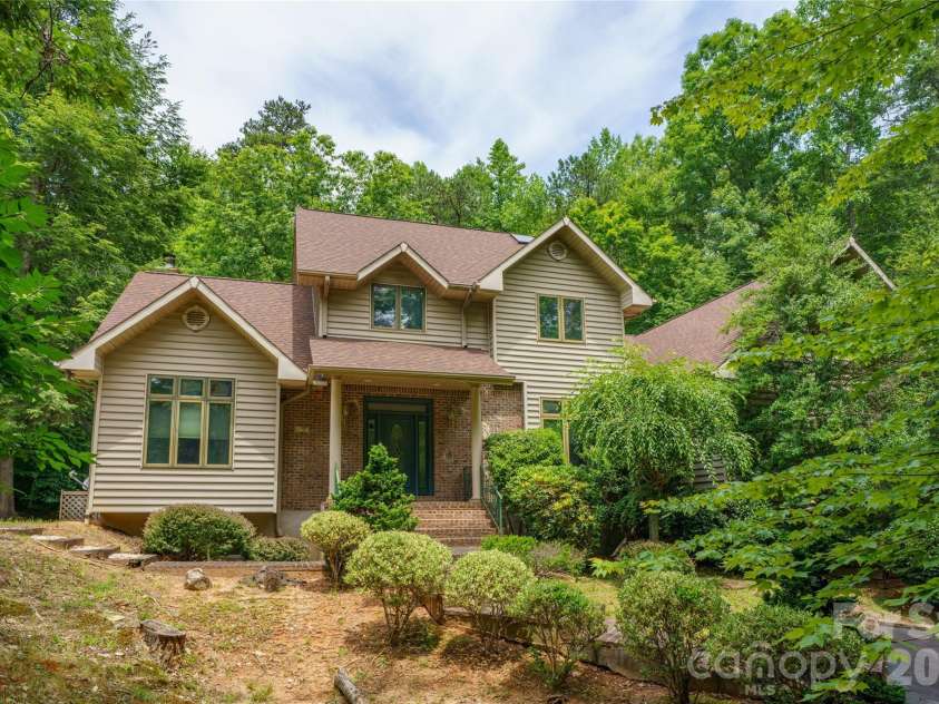 136 Rumbling Bald Road, Lake Lure, NC 28746.  MLS# CAR4393328, YatesRealty ID 30129. Front of home