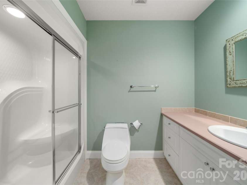 136 Rumbling Bald Road, Lake Lure, NC 28746.  MLS# CAR4393328, YatesRealty ID 30129. Full bath on lower level