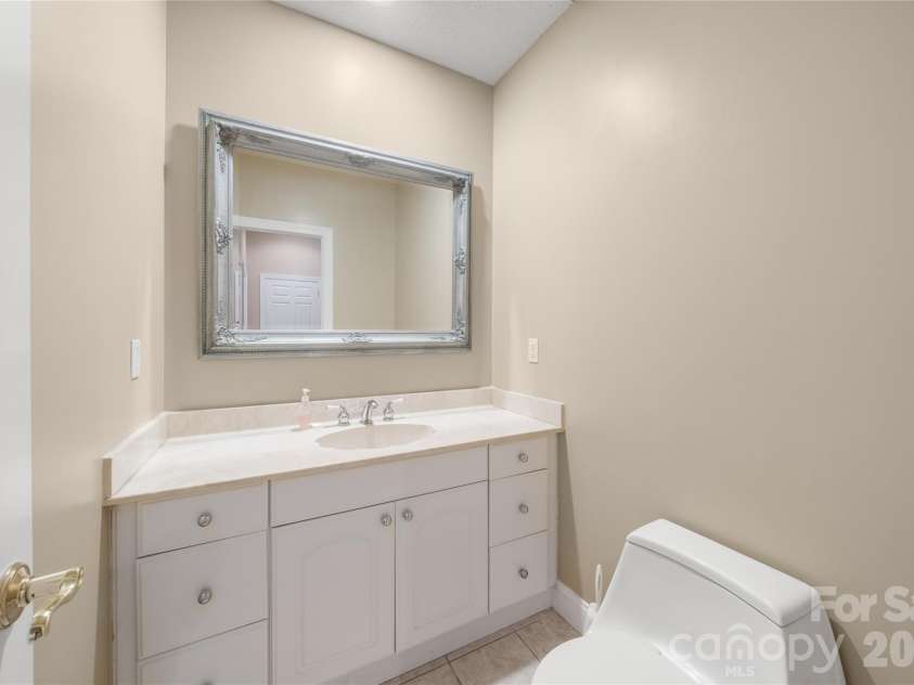 136 Rumbling Bald Road, Lake Lure, NC 28746.  MLS# CAR4393328, YatesRealty ID 30129. Half bath main level