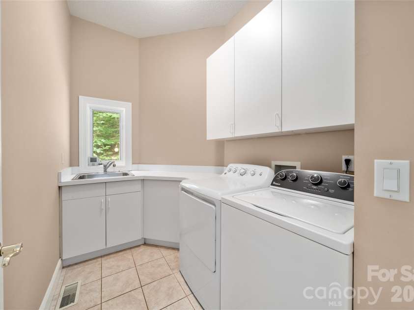 136 Rumbling Bald Road, Lake Lure, NC 28746.  MLS# CAR4393328, YatesRealty ID 30129. Laundry main level