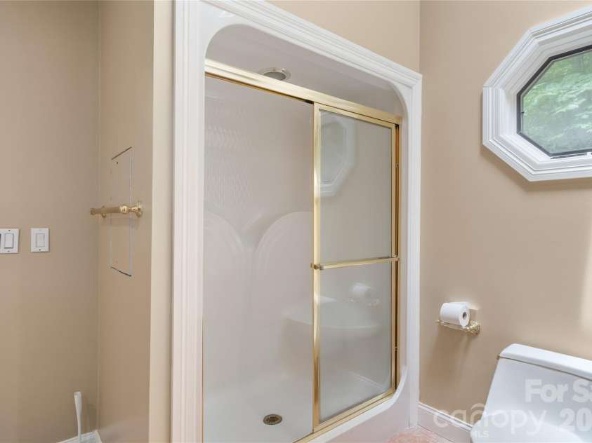136 Rumbling Bald Road, Lake Lure, NC 28746.  MLS# CAR4393328, YatesRealty ID 30129. Primary shower