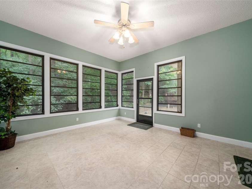136 Rumbling Bald Road, Lake Lure, NC 28746.  MLS# CAR4393328, YatesRealty ID 30129. Sunroom
