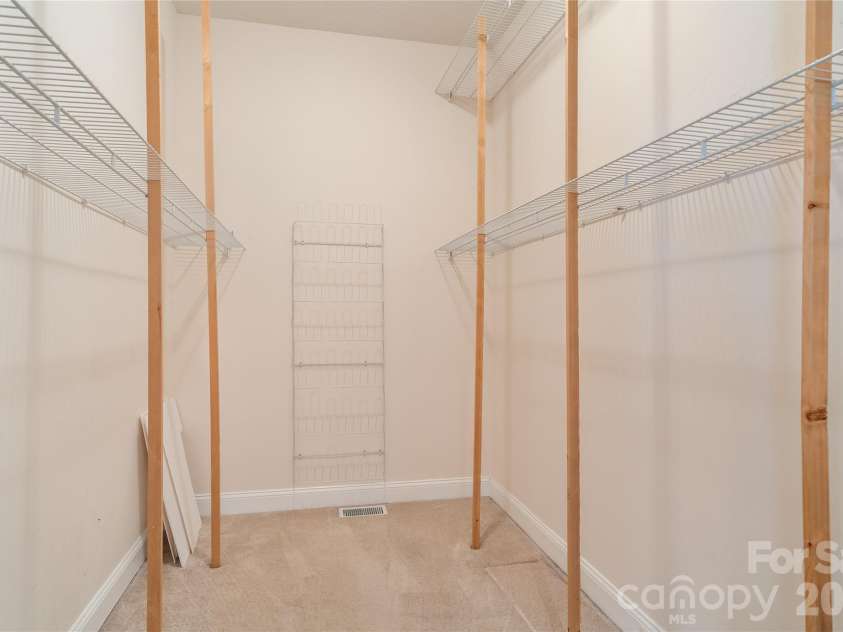136 Rumbling Bald Road, Lake Lure, NC 28746.  MLS# CAR4393328, YatesRealty ID 30129. Walk in closet main level