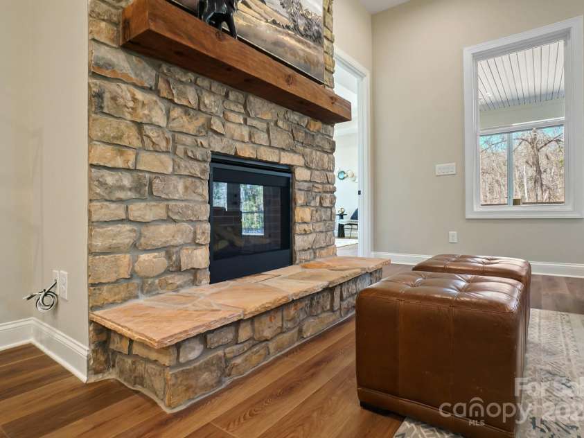 13101 Cozy Court, Charlotte, NC 28215.  MLS# CAR4232874, YatesRealty ID 30134. Living Room's Stone Gas Fireplace