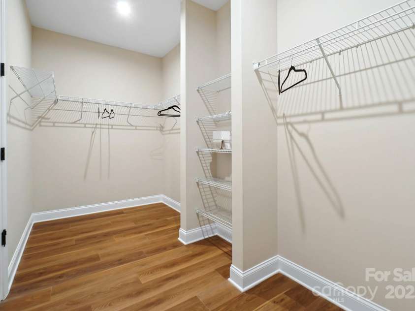 13101 Cozy Court, Charlotte, NC 28215.  MLS# CAR4232874, YatesRealty ID 30134. Primary Bedroom's Walk-in Closet