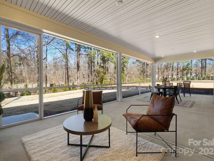 13101 Cozy Court, Charlotte, NC 28215.  MLS# CAR4232874, YatesRealty ID 30134. Screened Lanai overlooks the private Backyard and natural bike park across the street