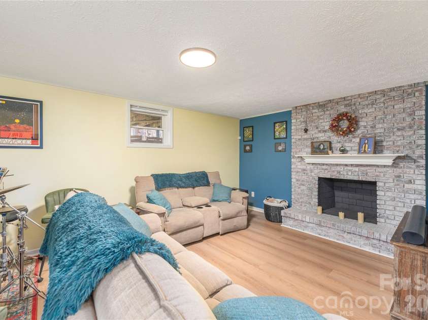 330 Woody Lane, Asheville, NC 28804.  MLS# CAR4354076, YatesRealty ID 30139. Den w/ fireplace