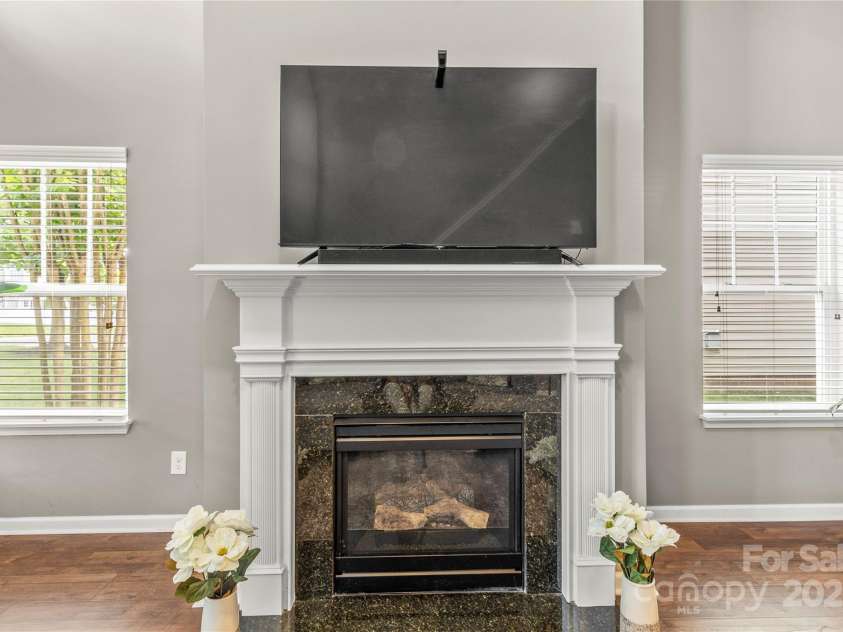 111 Tilton Drive, Mooresville, NC 28115.  MLS# CAR4254462, YatesRealty ID 30141. Gas fireplace with TV above