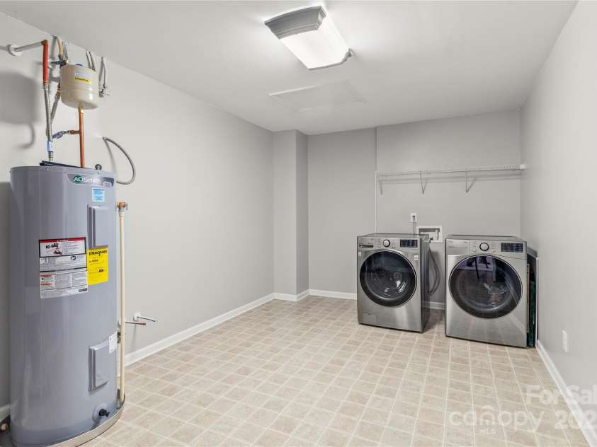 111 Tilton Drive, Mooresville, NC 28115.  MLS# CAR4254462, YatesRealty ID 30141. HUGE upstairs laundry area w/sink hookup & lots of room for storage.