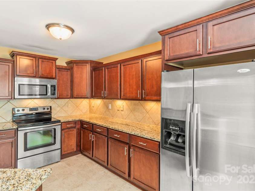 111 Tilton Drive, Mooresville, NC 28115.  MLS# CAR4254462, YatesRealty ID 30141. Kitchen with lots of cabinets and pantry. All appliances included.