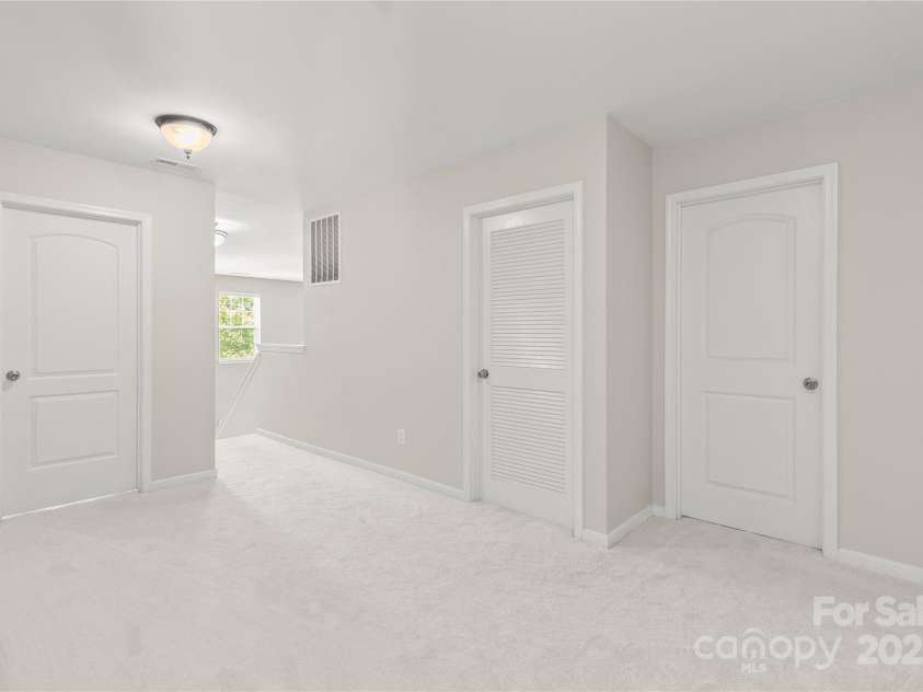 111 Tilton Drive, Mooresville, NC 28115.  MLS# CAR4254462, YatesRealty ID 30141. Large upstairs landing area - new carpet.