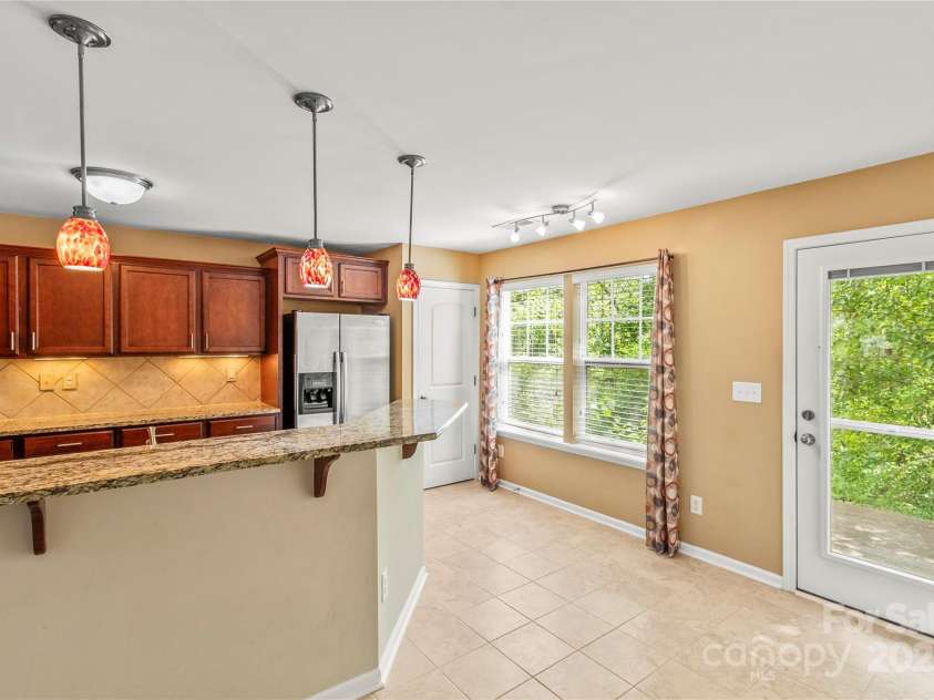 111 Tilton Drive, Mooresville, NC 28115.  MLS# CAR4254462, YatesRealty ID 30141. Snack bar in kitchen.