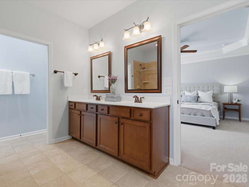 1004 Mava Court, Indian Land, SC 29707.  MLS# CAR4379129, YatesRealty ID 30144. Double vanity with separate framed mirrors.