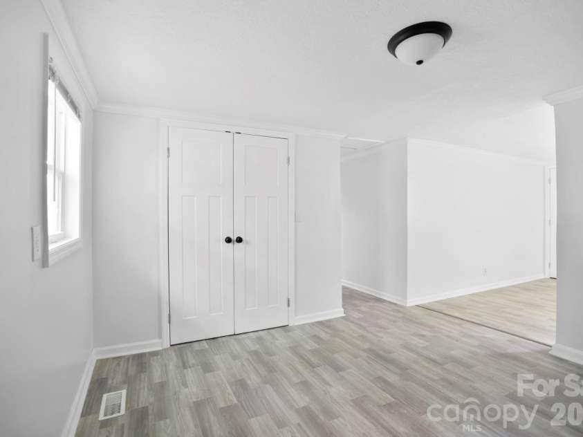 1007 Fork Road, Barnardsville, NC 28709.  MLS# CAR4374690, YatesRealty ID 30146. Dining area and doors to laundry room