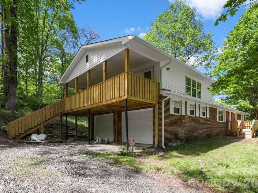 1007 Fork Road, Barnardsville, NC 28709.  MLS# CAR4374690, YatesRealty ID 30146. Front and side view of 1107 N Fork Rd, Barnardsville