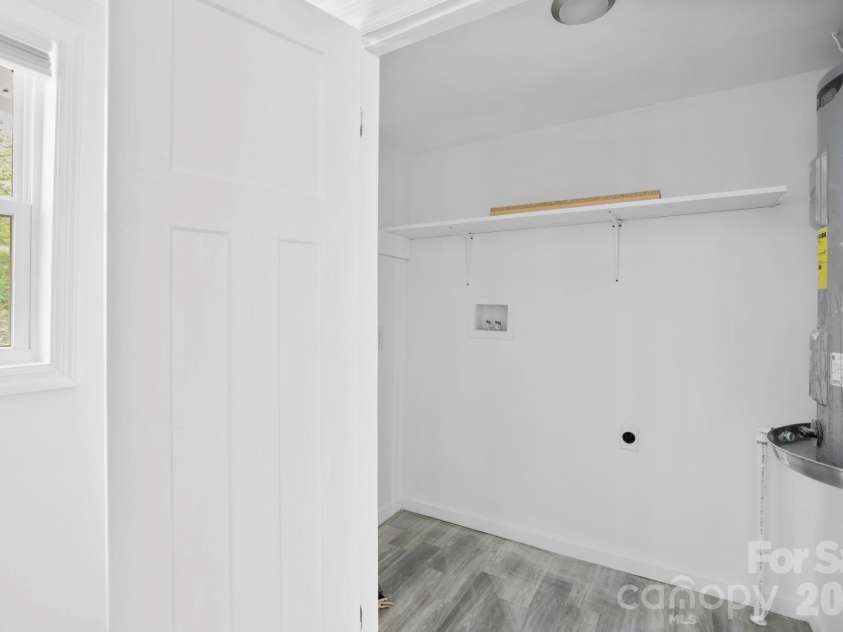 1007 Fork Road, Barnardsville, NC 28709.  MLS# CAR4374690, YatesRealty ID 30146. Laundry room with water heater