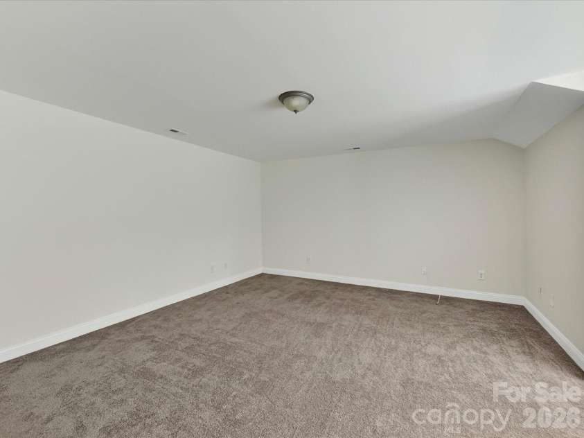 10507 Glenmeade Road, Cornelius, NC 28031.  MLS# CAR4391607, YatesRealty ID 30154. Expansive bonus room offers exceptional flexibility with ample space for a media room, playroom, home gym, office, or additional living area.